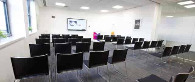 Meeting room at Inspire@ Horizon Leeds with sleek black chairs for corporate events.
