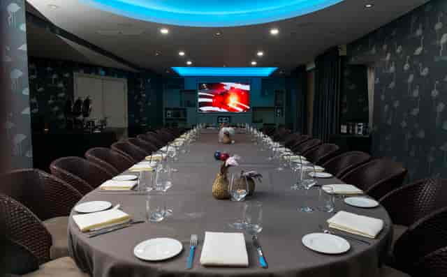 La Cantina meeting room with oval table, ideal for corporate events and gatherings.