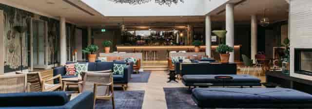 Stylish Wintergarden lounge at St Georges Hotel, ideal for networking and meetings.