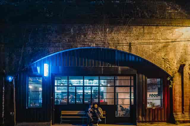Cozy Kilder bar with warm lighting, perfect for networking events and social gatherings.