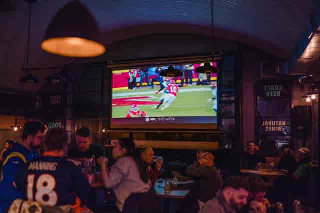 Lively Kilder bar with large screen, perfect for sports watch parties and gatherings.
