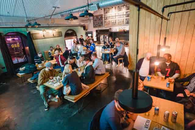 Vibrant Kilder bar with communal seating, ideal for networking and social events.