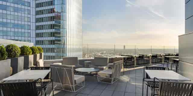 Stylish rooftop restaurant in Meliá Paris La Défense, perfect for upscale events and gatherings.