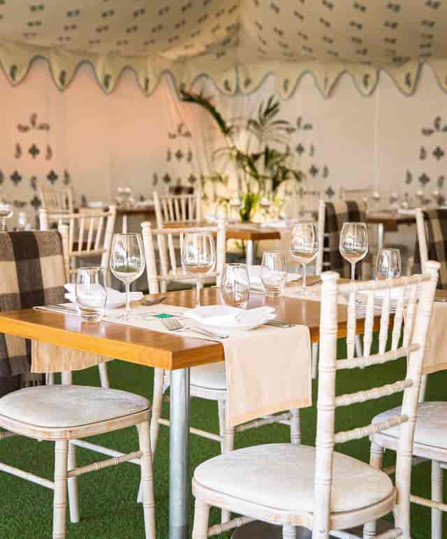 Elegant dining area in Babur's Marquee, perfect for upscale corporate events and gatherings.