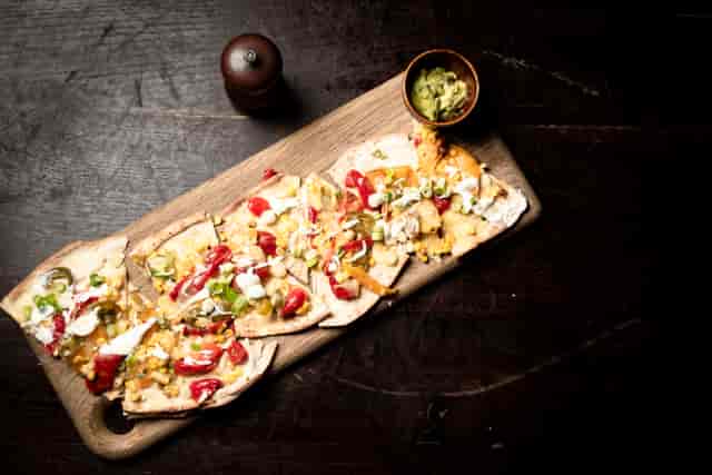 Vibrant nacho platter for casual networking events at Topolski venue.