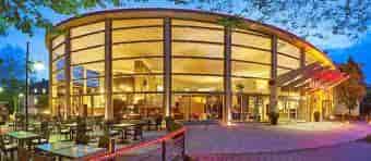 Modern Sheraton Offenbach Hotel venue with glass walls for meetings and events.