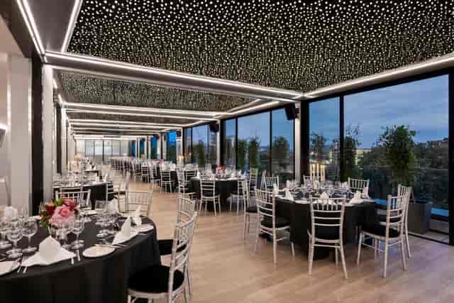 Christmas party at Blue Orchid Hotels with elegant tables and twinkling lights.
