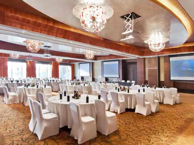 Champagne Ballroom at Novotel Mumbai: elegant event space for conferences with chandeliers.