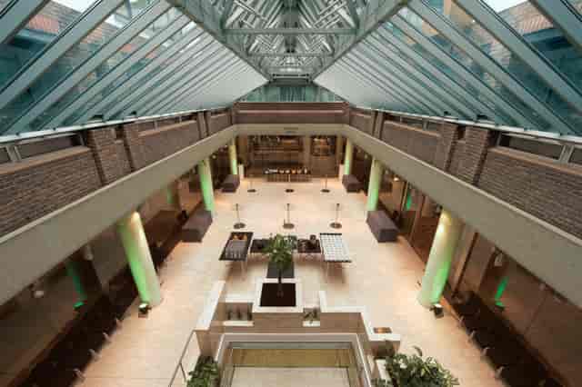 Max Rayne Atrium with glass ceiling, perfect for networking and social events.