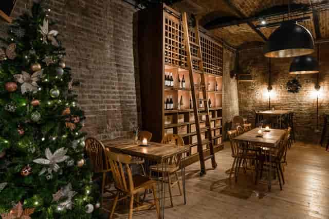 Cozy rustic dining room with exposed brick, ideal for holiday gatherings and intimate dinners.