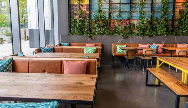 Vibrant event space at Babel Beerhouse with cozy seating for networking and meetings.