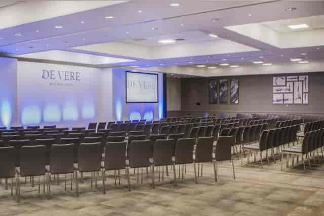 Event space at De Vere Beaumont Estate with chairs for a professional conference.