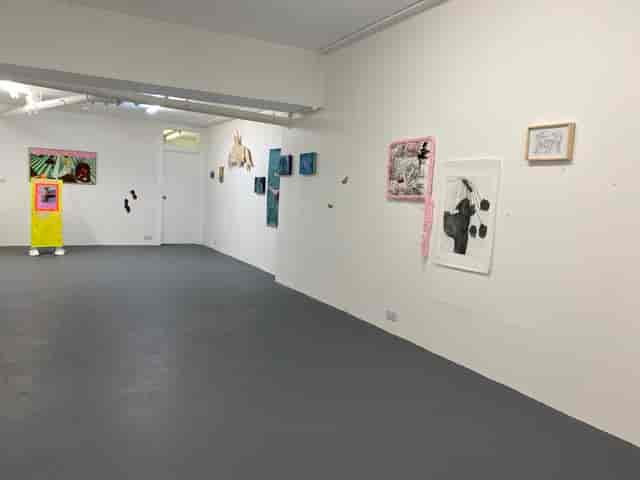 Contemporary art gallery space with white walls for creative events and exhibitions.