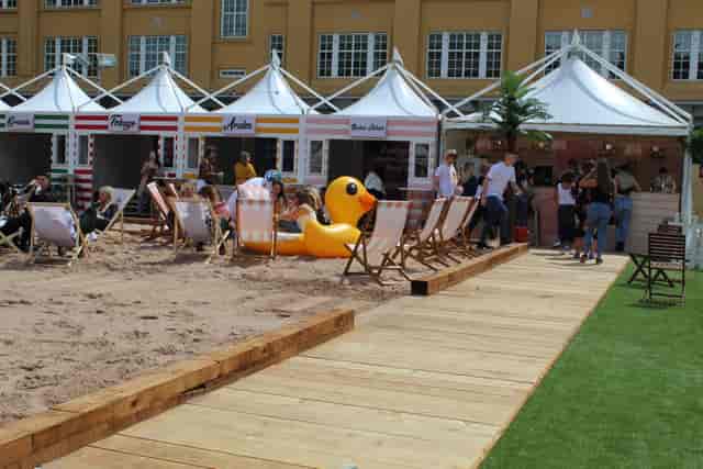 City Beach London with sandy area, deck chairs, and inflatable duck for summer events.