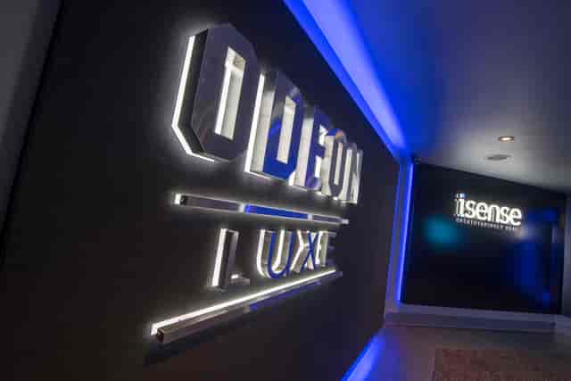 Odeon Luxe Birmingham entrance with illuminated signage for upscale events and screenings.