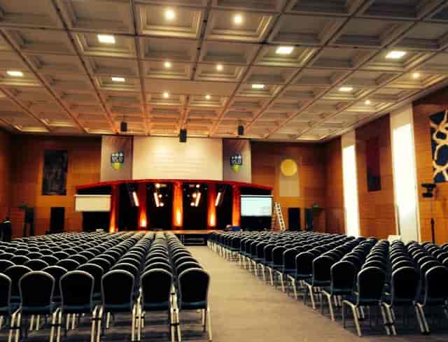 O'Reilly Hall conference setup with stage, chairs, and modern design for corporate events.