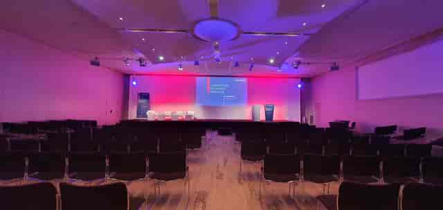 Event space in Grands Causses, Aveyron with purple lighting for presentations.