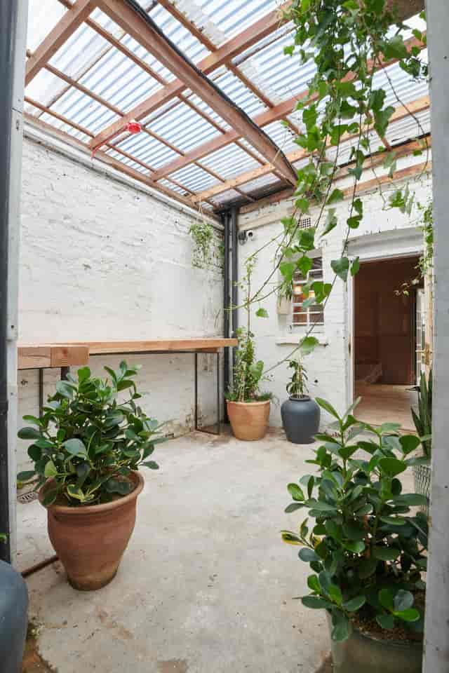 Private Snug event space with exposed brick, perfect for networking and workshops.