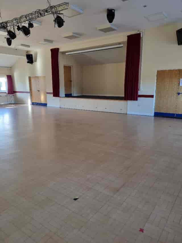 Windsor Hall in Skipsea Village: spacious event venue with raised stage for gatherings.