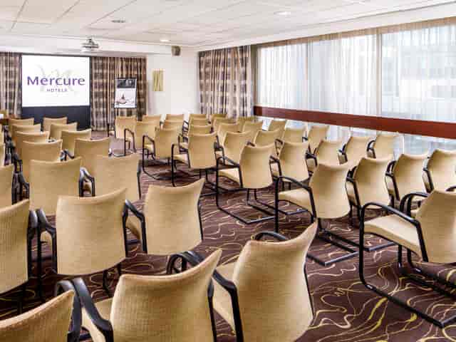 International Suite meeting room at Mercure Manchester, bright space for presentations.