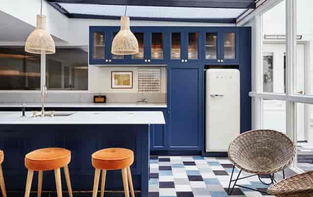 Modern kitchen in The Hoxton Amsterdam, featuring blue cabinetry for events and meetings.