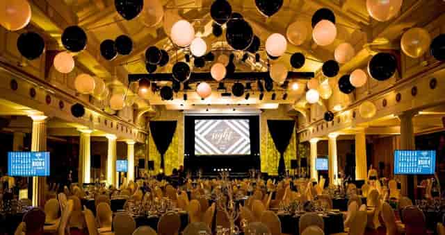 Elegant RDS Concert Hall setup for gala or corporate event with black, white, and gold decor.