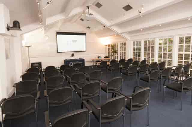 Hardy Room in De Morgan House: bright meeting space with projector for workshops and presentations.