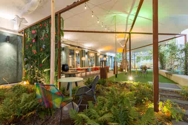 Urban Tent at A-Stay: vibrant outdoor event space with lush greenery for gatherings.