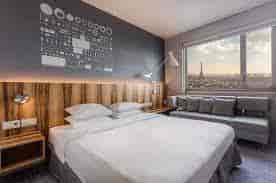 Modern hotel room in Hyatt Regency Paris Etoile, perfect for meetings and retreats.