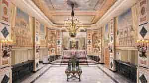 Opulent Westin Palace Madrid lobby with grand chandelier, ideal for upscale events.