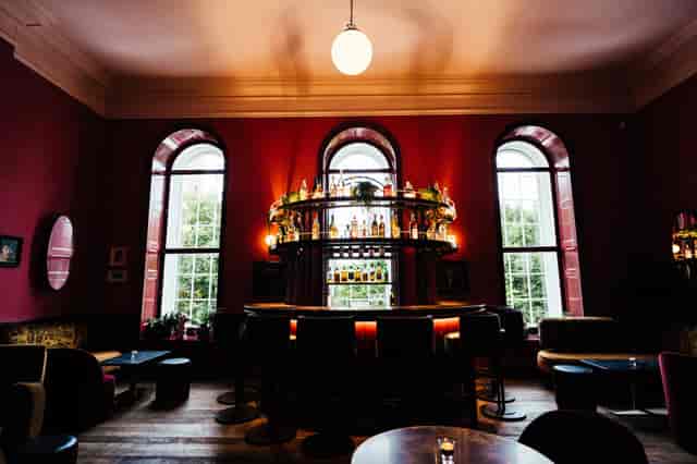 Stylish bar at The Salon in Kindred for elegant cocktail receptions and networking events.