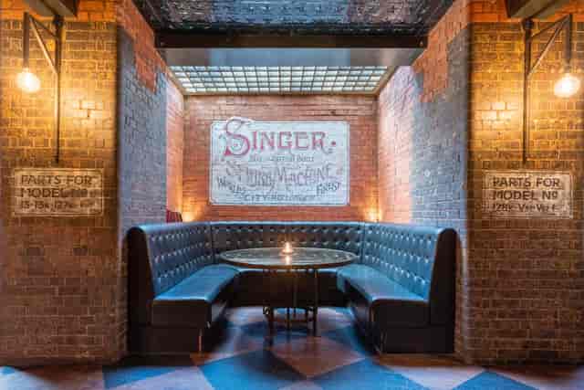 5CC Cocktail Bar seating area with vintage decor, ideal for networking events and meetings.