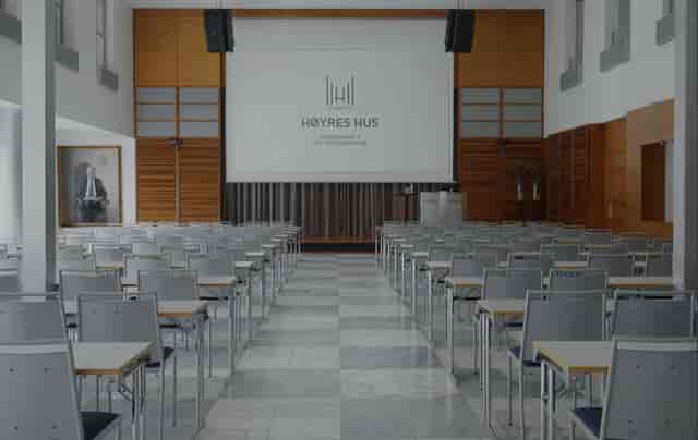 Conference room at Nordengen, featuring a large screen for professional meetings and events.