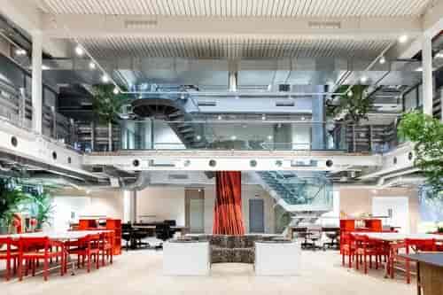 Modern event venue 180 Atrium with natural light and flexible seating for meetings.