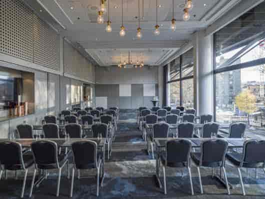 Versatile meeting room with natural light for corporate events in Radisson Blu Oslo.