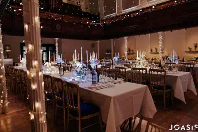 Elegant event space in The Amadeus with fine china and floral centerpieces.