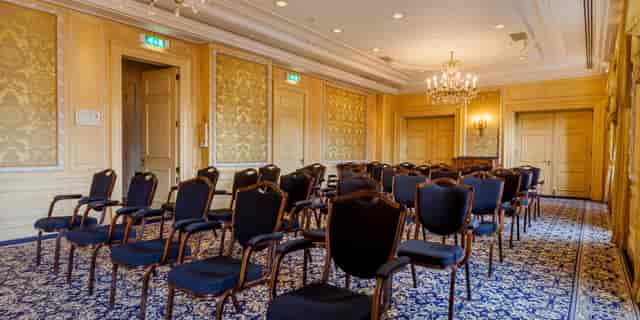 Elegant Stadhouders Room with black chairs, ideal for corporate meetings and upscale events.