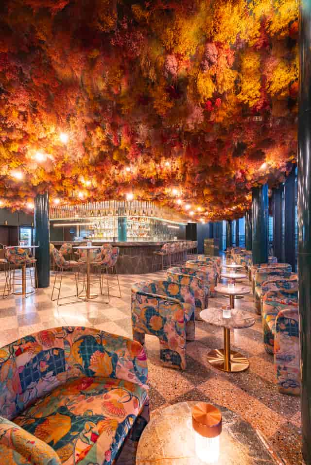 Vibrant Florattica venue with floral ceiling, ideal for upscale events and celebrations.