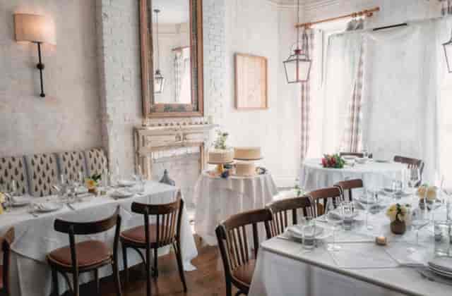 Elegant dining room in Bobo, NY with floral centerpieces for events and gatherings.