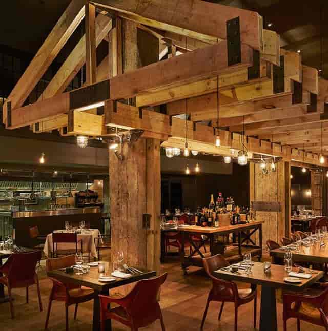 Stylish restaurant with exposed beams, ideal for private dining and culinary events.