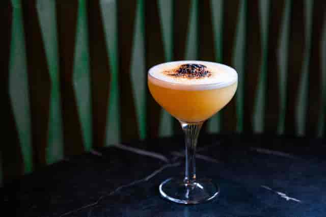 Elegant cocktail in a premium glass at The Clubhouse, perfect for networking events.