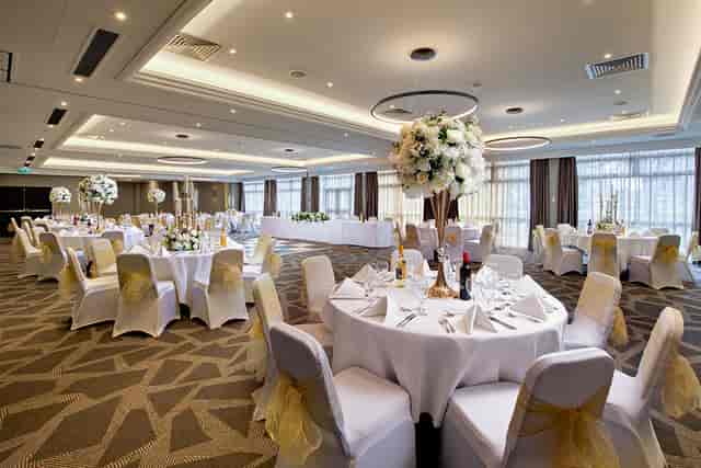 Ealing Suite at DoubleTree London, elegant wedding venue with floral centerpieces.