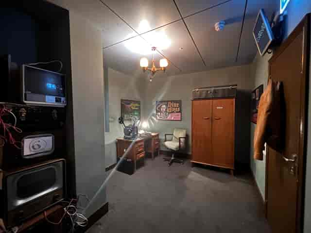 Vintage meeting room in Spooky Escape Room for unique events and creative shoots.