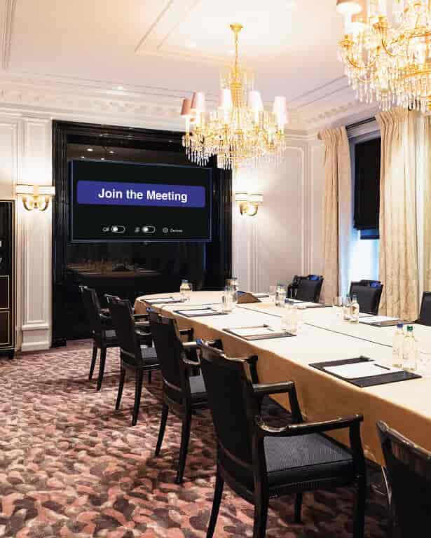 Elegant meeting room at Salon V, Baur Au Lac, ideal for hybrid events and presentations.
