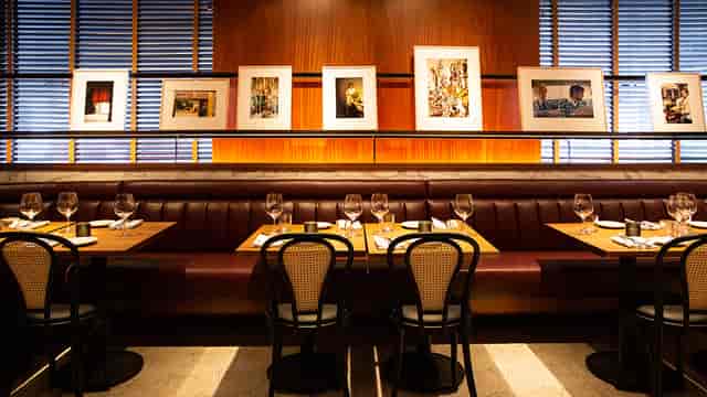 Private dining room at Smyths Tavern with elegant table settings for corporate events.