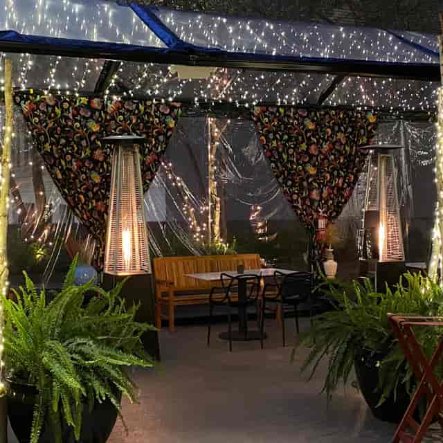 Private dining room with elegant drapery, perfect for outdoor events and intimate dinners.