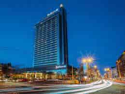 Radisson Blu Latvija at dusk, ideal venue for conferences and events.