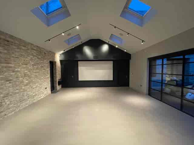 Modern event space with high ceilings, ideal for corporate meetings and workshops.