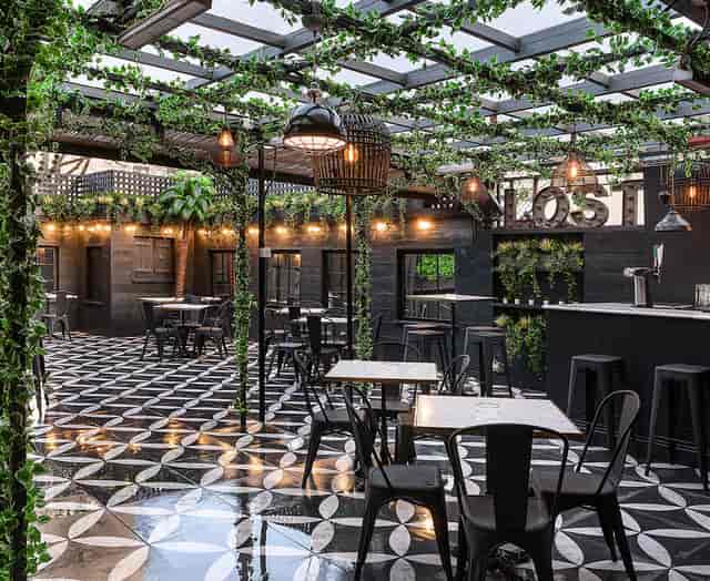 Stylish event space with greenery and black-and-white tiles at Lost Society Battersea.