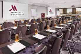 Meeting room at Frankfurt Marriott Hotel, ready for conferences with natural light.